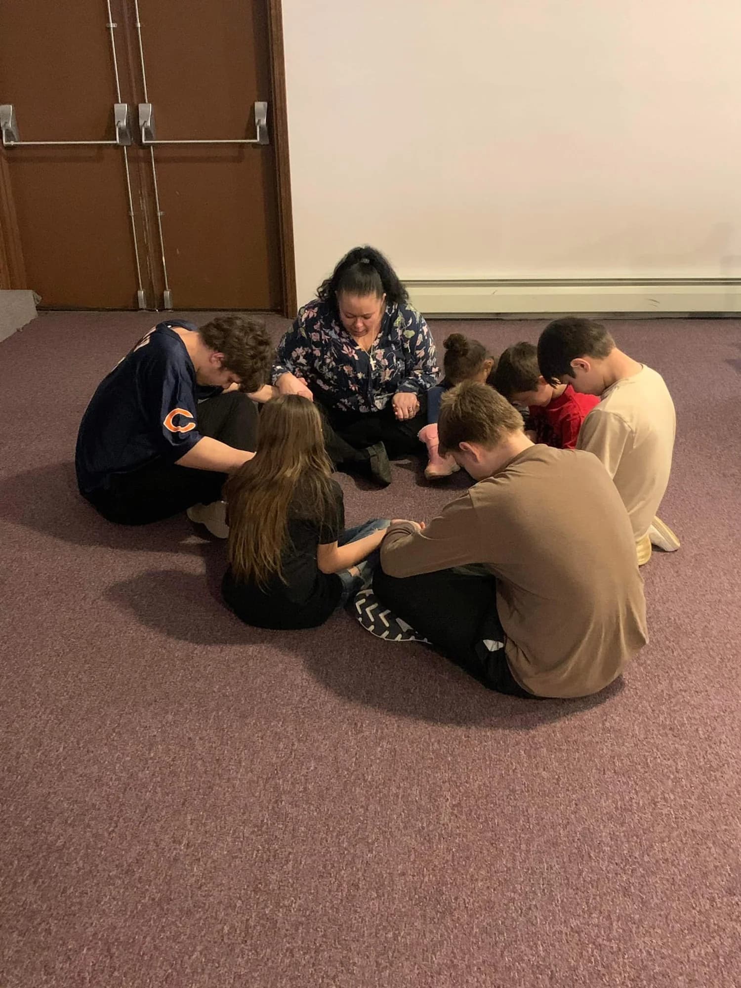 Members of Redemption Place Church praying together